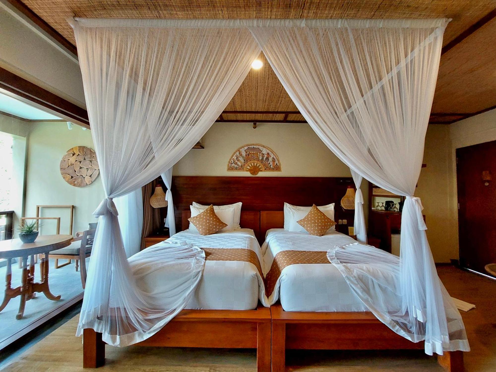 Ubud Nyuh Bali Resort & Spa Εξωτερικό φωτογραφία A mosquito net over a bed
