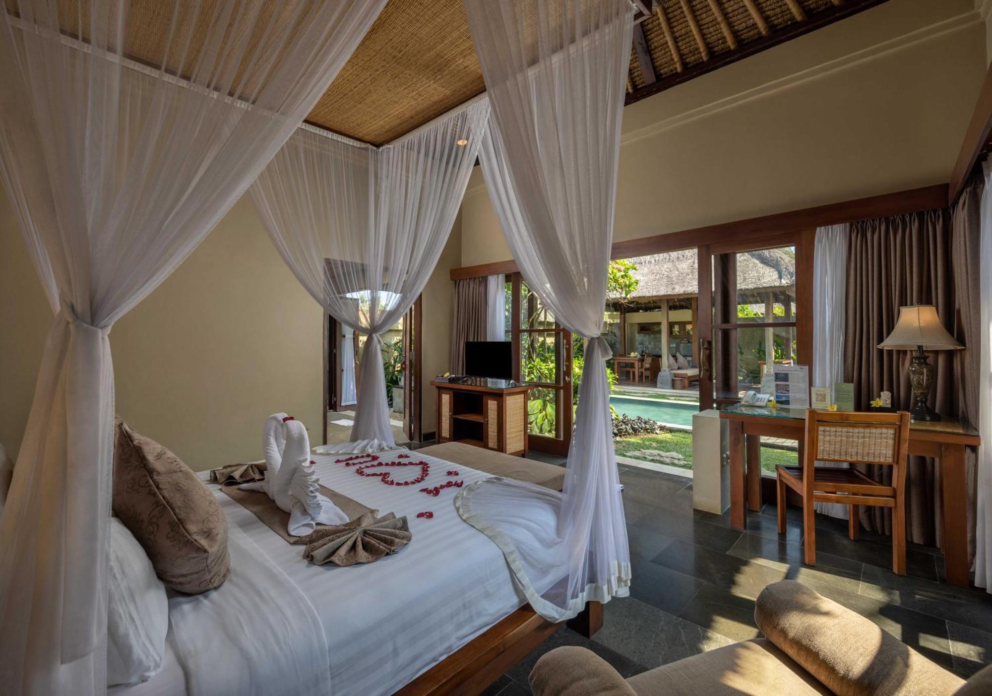 Ubud Nyuh Bali Resort & Spa Δωμάτιο φωτογραφία A bedroom at the resort