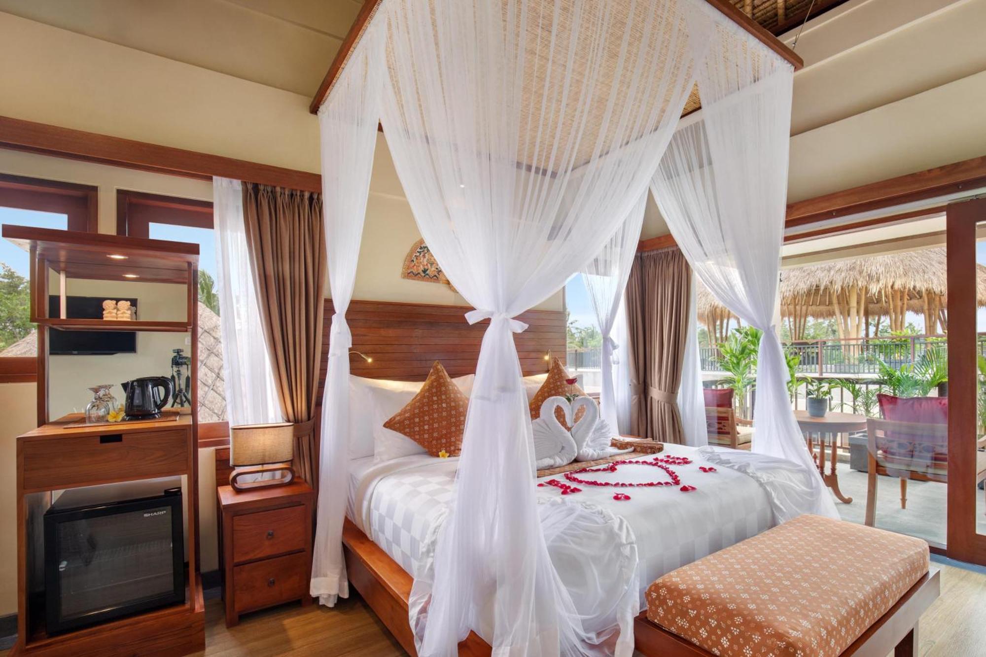 Ubud Nyuh Bali Resort & Spa Δωμάτιο φωτογραφία A canopy bed