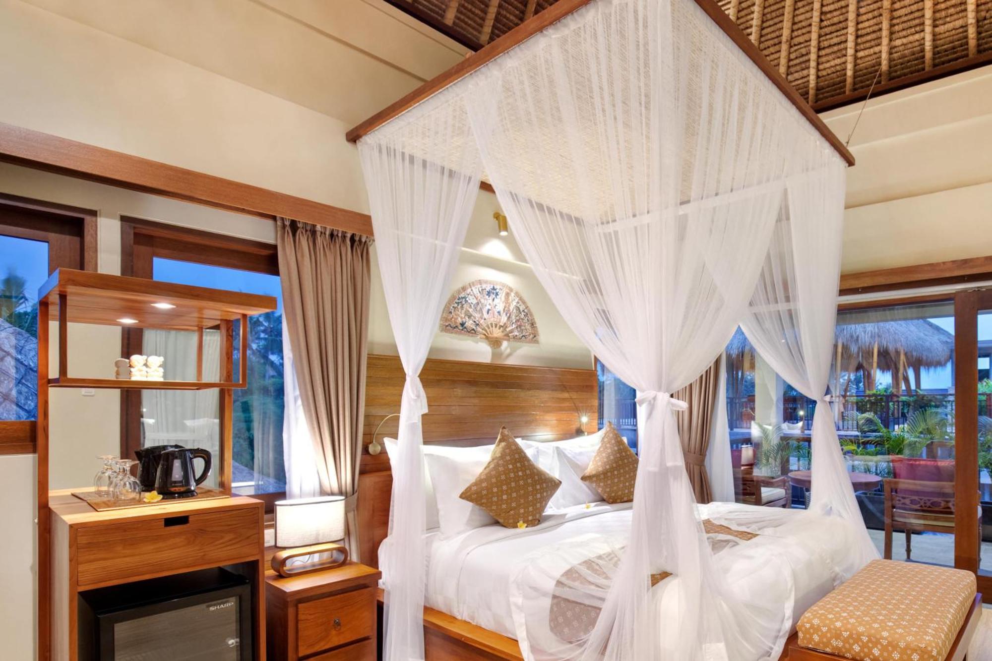 Ubud Nyuh Bali Resort & Spa Δωμάτιο φωτογραφία A mosquito net over a bed